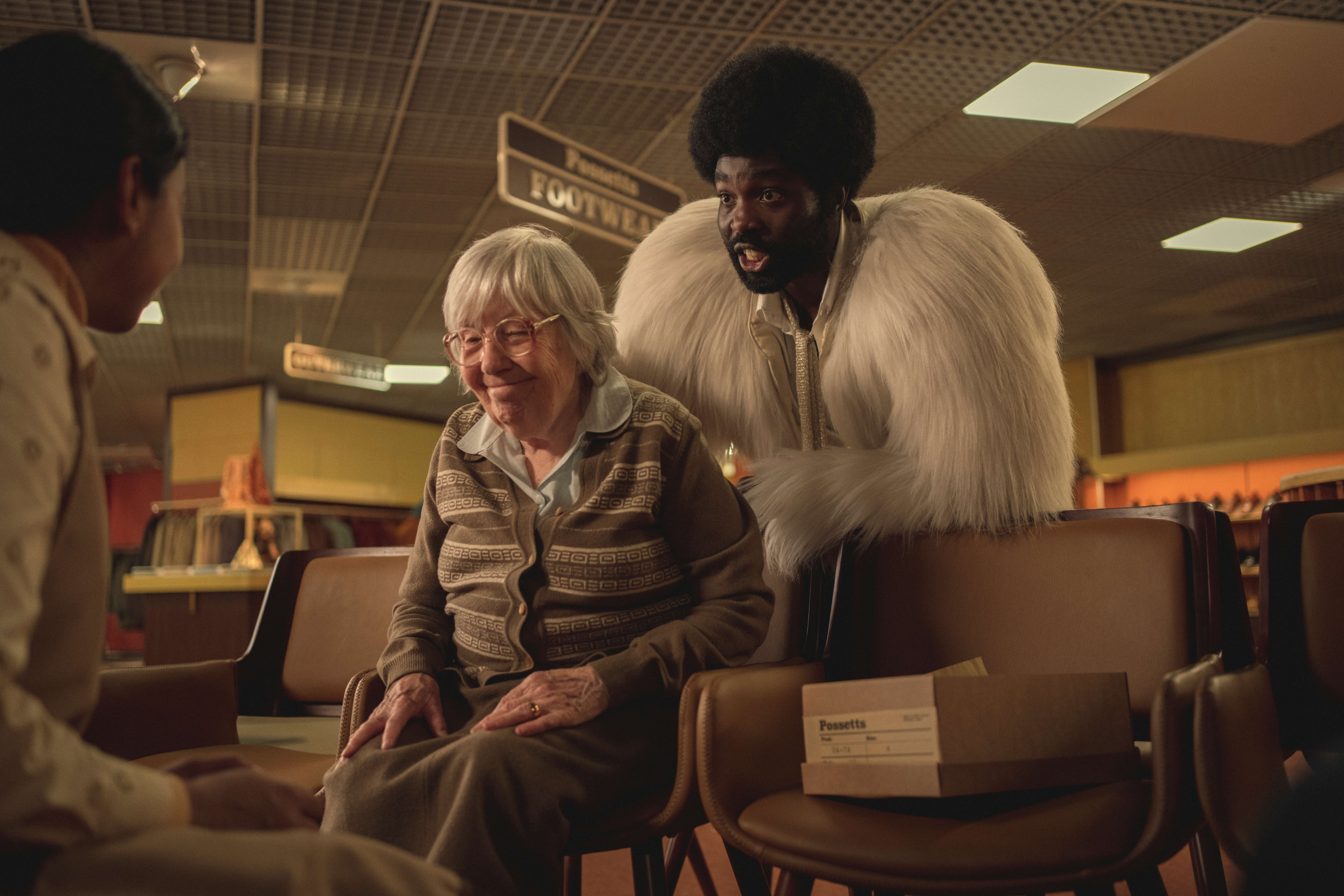 Red Book. (L to R) Anjana Vasan as Nida, Janie Booth as Sweet Gran, Paapa Essiedu as Gaap in Red Book in Black Mirror Demon 79